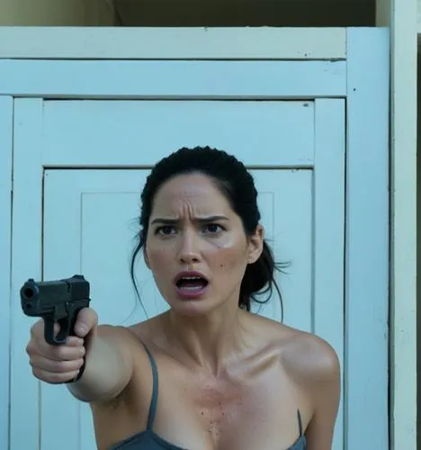 Olivia Munn is not wearing clothes. 
She is an alleyway. 

She is standing up and pointing a gun at a zombie,a woman holding a gun making a face in front of a doorway,sicario,woman holding gun,holding