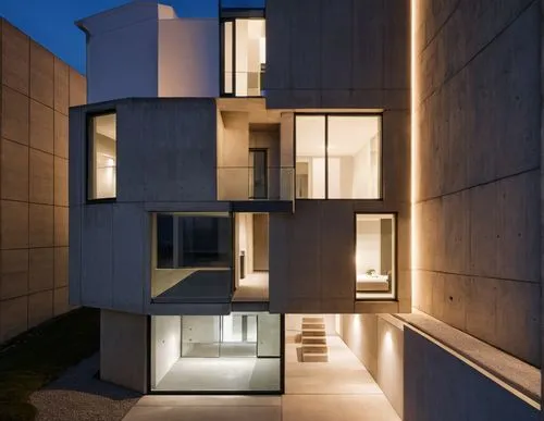 a modern building is lit up at night,cubic house,modern architecture,cube house,eisenman,corbu,glass facade,architektur,seidler,hejduk,associati,architectes,architettura,siza,modern house,multistory,k