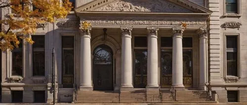 Historic bank building, Beaux-Arts style, Fort Wayne, Indiana, grand stone facade, ornate details, classical columns, arched windows, rusticated stonework, granite foundation, intricate carvings, bron