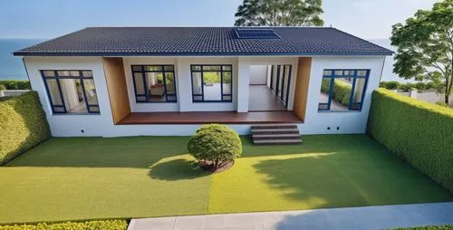 楼顶是平房，平板砖，墙壁是白色的,golf lawn,artificial grass,bungalow,garden elevation,buxus,danish house,landscape designers sydney,grass roof,showhouse,house shape,landscape design sydney,lohaus,cube house,green law