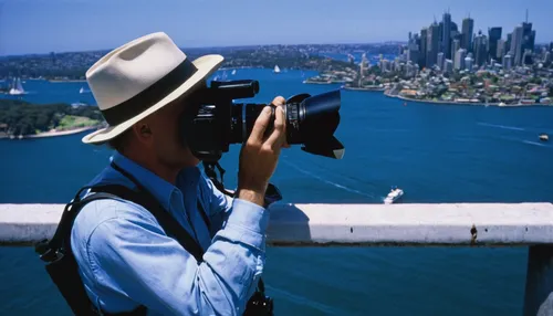 Marc Turcan photographing Sydney Harbor in Australia,viewfinder,binoculars,twin-lens reflex,binocular,rangefinder,view over sydney,13 august 1961,lubitel 2,tourist,sydney outlook,photographers head,sy