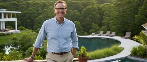 Carson Mcelheney, landscape architect, middle-aged man, short brown hair, glasses, casual attire, holding a blueprint, standing in front of a modern villa, surrounded by lush greenery, hills, and a se