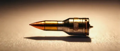 Hd slow motion bullet wallpapers image pics download,a pistol shaped gland,bullet shells,bullet,cartridge,ammunition,bullets,pen nib,pencil sharpener,pencil icon,45 acp,pencil sharpener waste,nib,push