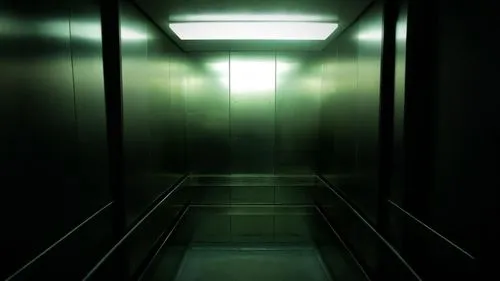 an empty dark hallway with no doors,levator,corridors,elevator,elevators,corridor,hallway