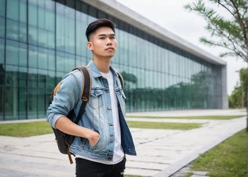 Architecture student, young adult, male/female, casual wear, denim jacket, white shirt, ripped jeans, sneakers, backpack, holding a large portfolio, standing in front of a university building, modern 