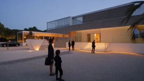 minimum light 
,the two people are walking toward the building,quadriennale,dinesen,school design,champalimaud,epfl,serralves,glucksman,triennale,futuristic art museum,adjaye,architectes,snohetta,arch