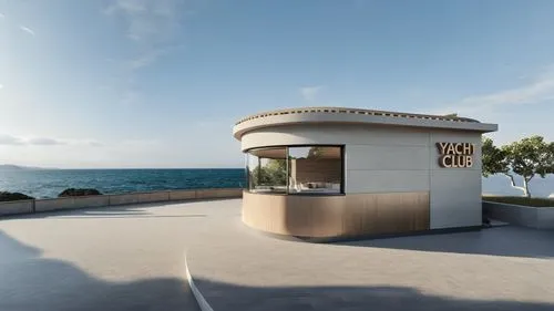 seaside, and yacht,a round building with a small round doorway is on the walkway near a large body of water,lifeguard tower,kiosk