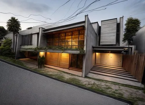 diseño exterior de una residencia estilo minimalista, con elementos de concreto, madera, cristal, rejilla de acero, vegetación, iluminación nocturna perfcetamente detallada, fotografia hiperrealista,a