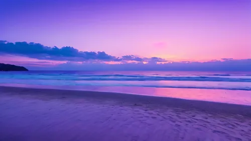 When the sun sets on the beach. The sky is painted with a breathtaking palette of pastel pastel colors - dusty blue, with soft pink colors, And fantastic lavender.Someone is basking in the sun,purple 