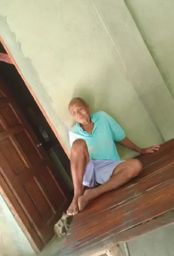 an elderly man sits on the floor of an old house,pattabhi,girl on the stairs,planking,stairwell,block balcony,iyengar