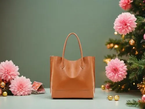 以聖誕節為主題，繽紛亮麗的佈景，營造節慶與時尚感,a brown handbag sitting next to pink flowers,longchamp,shopping bag,delvaux,birkins,gift bag,celine