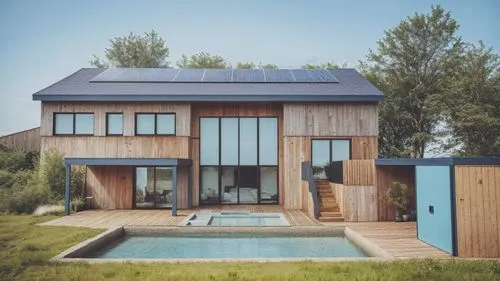 passivhaus,electrohome,timber house,weatherboarding,dunes house,wooden decking,inverted cottage,solarcity,cubic house,folding roof,wooden house,weatherboarded,summer house,modern house,mid century house,deckhouse,glickenhaus,danish house,homebuilding,smart house