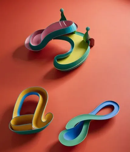 curved ribbon,cookie cutters,decorative letters,paper chain,paper snakes,wooden toys,airbnb logo,alphabet pasta,paper clips,3d bicoin,handles,letter chain,plasticine,3d object,ribbons,corner balloons,