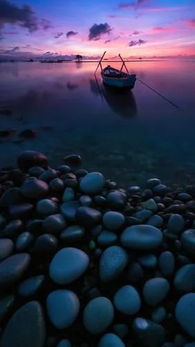 old wooden boat at sunrise,sunken boat,boat landscape,background with stones,calmness,boat on sea