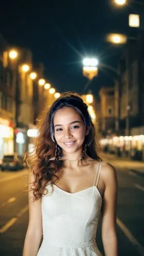 As the full city illuminates the night sky, a woman with long chestnut hair and piercings gazes intently at the beauty of her beauty. Her face radiates tense and radiant light, as deep breath beams fr