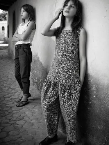 Two different women.,two girls are standing on the side walk,milutinovic,ostroh,girl praying,a girl with a camera,two girls,girl with cloth,Photography,Black and white photography,Black and White Phot