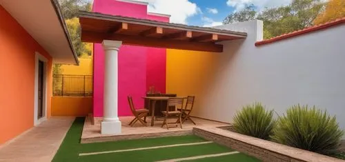 REMODELACION DE UNA CASA CON ESTILO MEXICANO, USO DE COLORES VIVOS, MADERA, PISOS DE BARRO, FLORES Y UN ESPEJO DE AGUA CON FUENTE EN UN MURO,a patio and the wall painted with vint colors,garden design