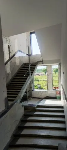 a stairway with an open window that overlooks the valley,escaleras,outside staircase,escalera,staircases,stairwells,stairwell