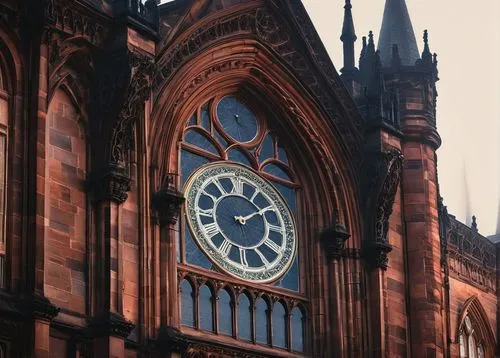 Glasgow, Scotland, Victorian-era building, Gothic Revival style, intricate stone carvings, stained glass windows, pointed arches, ribbed vaults, grand entrance, ornate facades, red sandstone walls, de