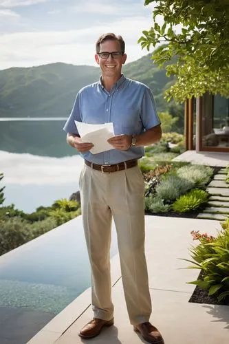 Carson Mcelheney, landscape architect, middle-aged man, short brown hair, glasses, casual attire, holding a blueprint, standing in front of a modern villa, surrounded by lush greenery, hills, and a se