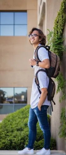 UC Irvine architecture student, young adult, casual wear, backpack, glasses, messy brown hair, relaxed posture, leaning against a modern building, concrete structure, large windows, minimalist interio