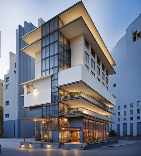 The building is a classical hotel.,an unusual building is lit up at night,julliard,modern architecture,seidler,faena,morphosis,juilliard,Photography,General,Realistic