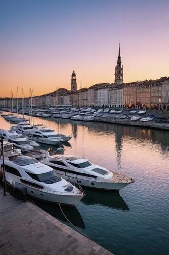 Tours, boats, architecture, harbor, evening time, golden hour, warm light reflecting off the calm water, sailboats, yachts, speedboats, moored alongside the dock, intricate stone bridges, historic bui