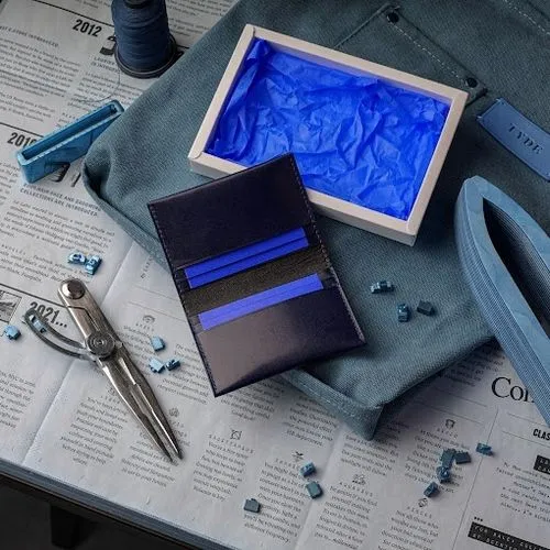 a table with a pair of scissors, a wallet and blue plastic,cyanotype,blueprints,blueprinting,blue painting,aerogel,ultramarine