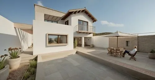 In a cozy, rustic-looking garden, a group of multi-layered animals gather around a large concrete structure with angular angular blocks. The building features intricate brickwork and intricate designs