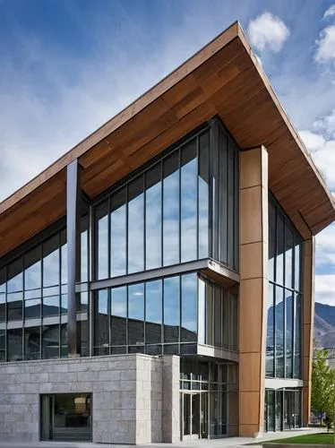 Modern architecture, Kamloops city hall, glass façade, steel structure, angular lines, asymmetrical composition, cantilevered roof, natural stone walls, wooden accents, floor-to-ceiling windows, minim