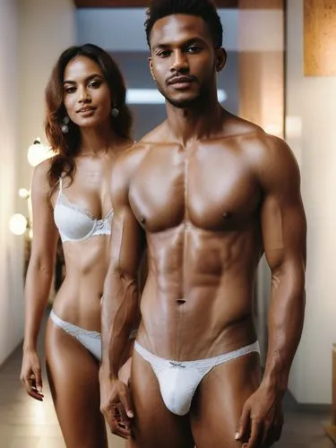 The sceneThe picture shows a man and a woman in a modern, well-lit interior. Both are wearing white underwear. The man stands in the foreground, is muscular and wears tight-fitting white underwear. Th