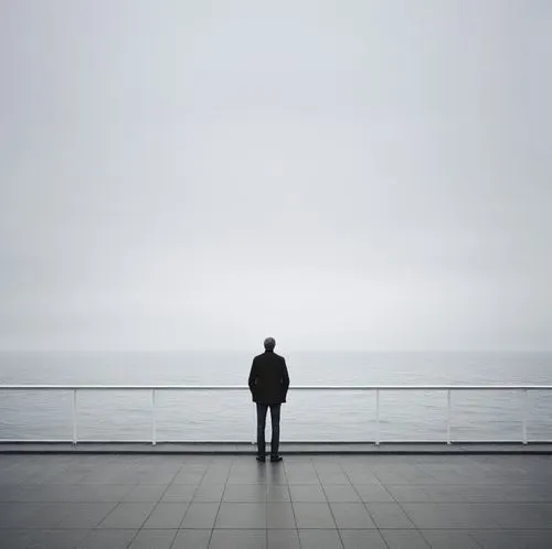 man,a man looking out over the ocean on an overcast day,to be alone,silhouette of man,man at the sea,loneliness,emptiness,man silhouette,Photography,Documentary Photography,Documentary Photography 04