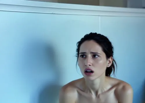 Same woman. She is in an abandoned science lab,a beautiful woman sitting on a bed while holding onto a towel,the girl in the bathtub,video scene,scared woman,bellisario,bathtub,webseries