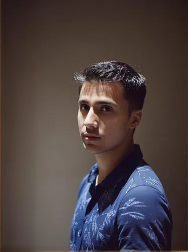 a man sitting at a table next to a bottle,nikhil,anirudh,pakistani boy,waqas,aditya,abhinav,Photography,General,Natural