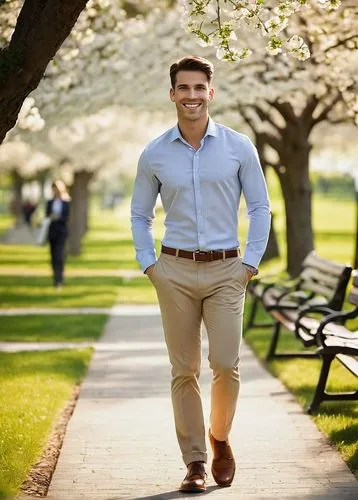 Young professional, male/female, 20s-30s, smiling, casual business attire, standing, relaxed posture, hands in pockets, scenic park, green grass, blooming flowers, walking path, trees with benches, su