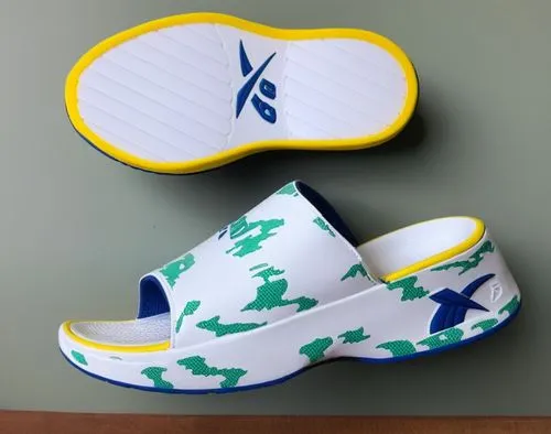 Open toe EVA material slide, white embossed Reebok logo, black with green, blue, magenta, and yellow 
accents color scheme ,EVA slide 2,leprechaun shoes,slipons,spinnakers,lebron james shoes,beach sho