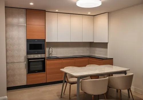 Visualization of a corner kitchen in a modern style with orange and beige cabinets. On the wall, there is a built-in black oven and microwave, and below is a black cooktop. The worktop is white with a