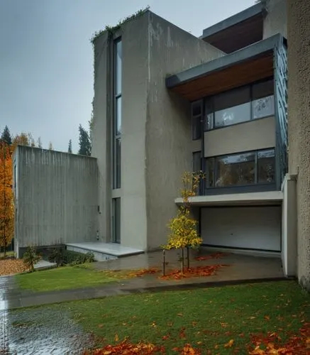 a modern architecture building with leaves on the ground,uvic,corbusier,breuer,langara,exposed concrete,mid century house,Photography,General,Realistic