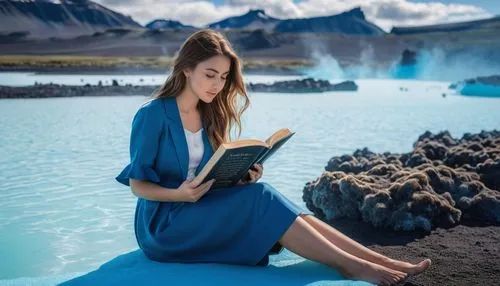 A girl with brown hair sits on a bank and reads a book in the background Blue Lagoon Iceland,geysers del tatio,del tatio,geysers el tatio,el tatio,geyser strokkur,geothermal energy,pamukkale,blue lago