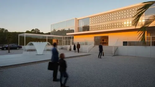 minimum light 
,two people walking by a building in front of palm trees,champalimaud,epfl,quadriennale,chancellery,serralves,kunstmuseum,technion,mipim,siza,nationalgalerie,soumaya museum,maxxi,boccon