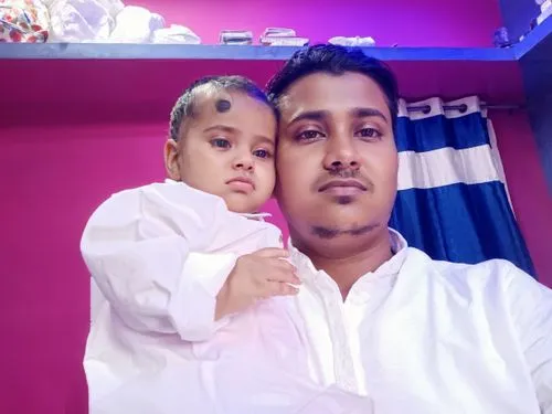 father with child,daughter,poriyal,kabir,pink background,thavil,arshan,lindia,cute baby,lalab,gulab,ghanta,digital photo frame,dhansak,jawaharlal,chitranna,purple background,pathiri,benagil,sadya