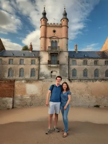 The girl with the large bust and the friendly boy friend, the freckles and the pretty fingers.,man and woman posing in front of an ancient building,royal castle of amboise,santenay,moritzburg castle,r