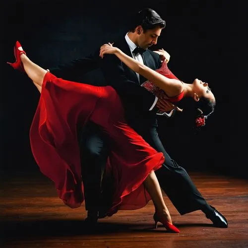 Artistas talentosos. Hermosos jóvenes, hombre y mujer, ejecutando un tango apasionado sobre un fondo negro de estudio. La seda del vestido rojo de la mujer contrasta con el traje negro del hombre, mie