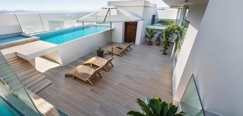 roof top pool,wooden decking,wood deck,block balcony,roof terrace,pool house,penthouse apartment,modern house,dunes house,decking,infinity swimming pool,landscape design sydney,holiday villa,tropical house,modern architecture,ocean view,landscape designers sydney,interior modern design,roof landscape,contemporary decor
