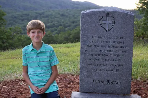 Write a heartwrenching story about Christian James' struggle with loss and redemption.,headstone,children's grave,memorial cross,soldier's grave,gravestone,grave stones,tombstone,memorial markers,tomb