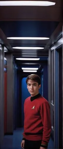 Wesley Crusher, Starfleet Academy, young adult, curious eyes, messy brown hair, casual pose, iconic red sweater with black stripes, white shirt underneath, dark blue pants, standing, USS Enterprise NC