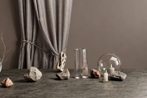 some rocks and vases on a table,table lamps,background with stones,natural stones,decanters,homeware,stone lamp,tabletoppers,votives,shashed glass,hand glass,kartell,showpieces,glass series,natural st