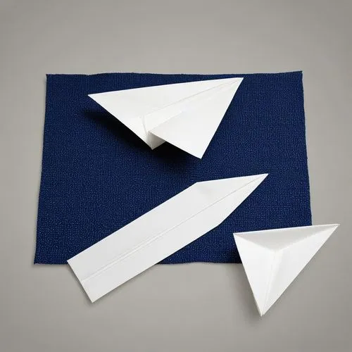 a folded napkin with two pieces of paper folded together,origami paper plane,paper airplanes,paper airplane,airmail envelope,pennant,paper plane