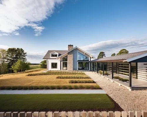 Modern house in American style. There is a mixed forest around. There is a lawn in front of the house.,an outdoor walkway in front of a home,ballymaloe,grass roof,dunes house,passivhaus,landscaped,kin