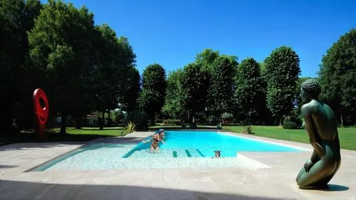 modern red  sculpture,outdoor pool,swimming pool,landscape designers sydney,garden of the fountain,sculpture park,garden sculpture,k13 submarine memorial park,landscape design sydney,swimming people,f